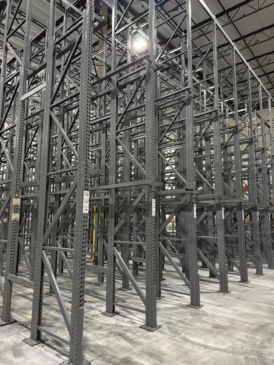 Close view of heavy-duty structural drive-in rack frames and diagonal bracing